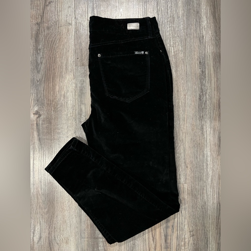 Black velvety pants.